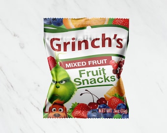 May include: A green Grinch character with a red Santa hat is on a bag of mixed fruit snacks. The bag is red, white, and green with the words "Grinch's Mixed Fruit Fruit Snacks" and "NET WT. 5oz (14g)".