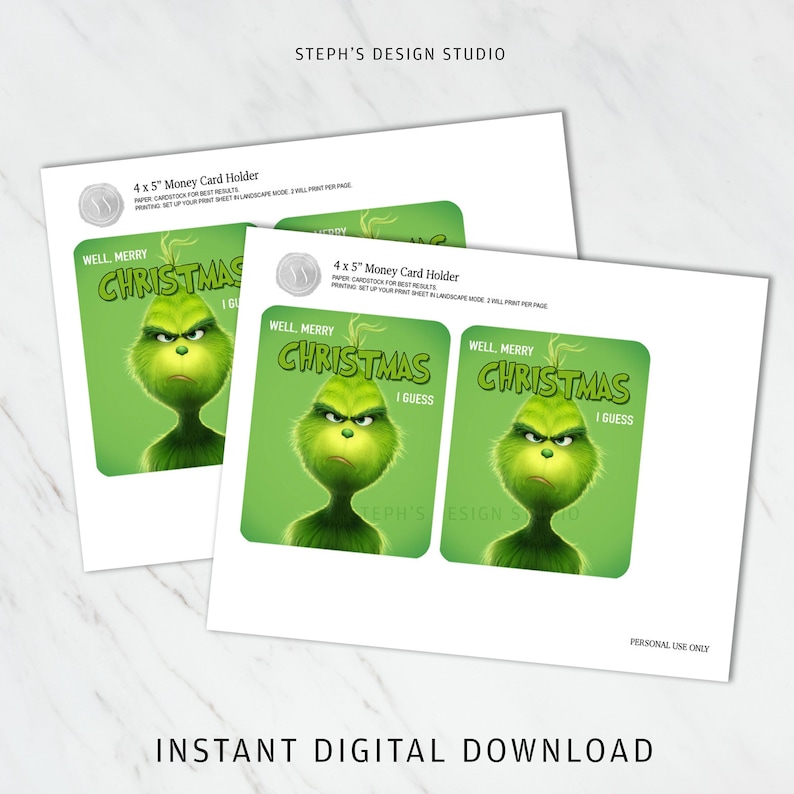May include: A digital printable 4 x 5 inch money card holder template featuring a green character with a grumpy expression. The text reads WELL, MERRY CHRISTMAS I GUESS. The design includes instructions for cardstock and landscape printing settings.