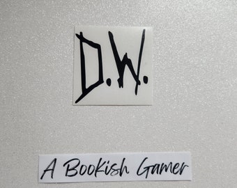May include: A white sticker with black lettering that says "D.W."