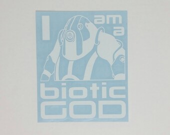 May include: A white vinyl sticker with a blue background featuring a cartoon character with a helmet and the text "I am a biotic GOD".