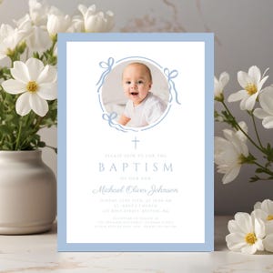 May include: A light blue baptism invitation with a photo of a baby in a circular frame with bow accents. The invitation includes the text "Please join us for the Baptism of our son Michael Oliver Johnson."