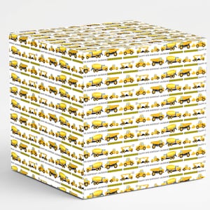 May include: White gift box wrapped in paper with a repeating pattern of yellow construction vehicles. The design includes dump trucks, cement mixers, and excavators. The text "HAPPY 8TH BIRTHDAY JACKSON" is also printed on the paper.