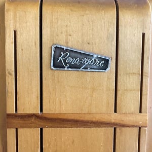 May include: A wooden knife block with a metal label that reads "Rona-ware".
