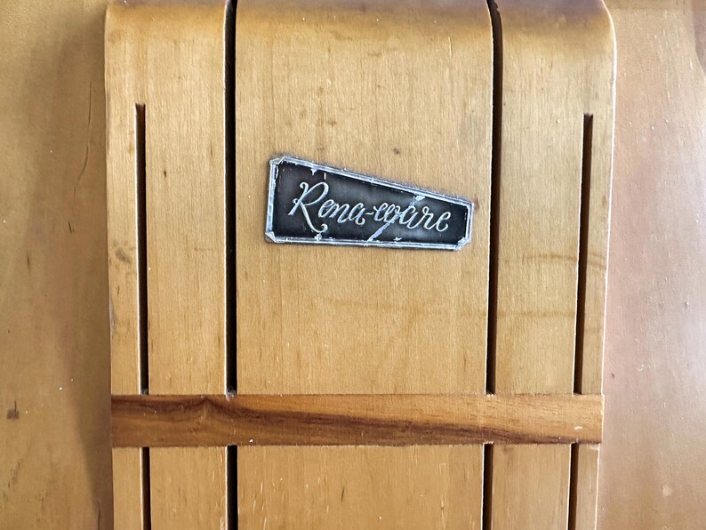 May include: A wooden knife block with a metal label that reads "Rona-ware".