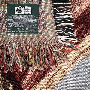 May include: A green label with white text that reads "Goodwin Weavers Est. 1812" and "100% Cotton Coton Algodon". The label has instructions for washing the fabric in English, French, and Spanish.