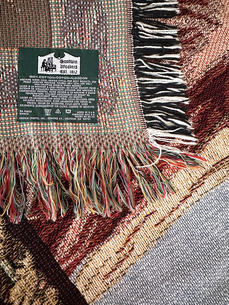 May include: A green label with white text that reads "Goodwin Weavers Est. 1812" and "100% Cotton Coton Algodon". The label has instructions for washing the fabric in English, French, and Spanish.