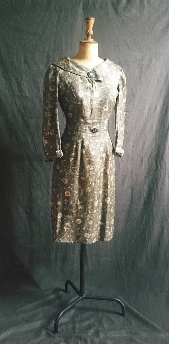 1950s hieroglyphics silk dress in olive green.
