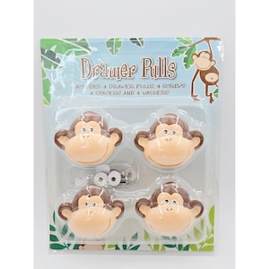 May include: A set of four monkey-shaped drawer pulls in a clear plastic blister pack. The packaging features the text Drawer Pulls and includes four drawer pulls, four screws, four spacers, and four washers. The monkey faces are tan and brown.