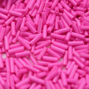20grams Camellia Bugle Beads: 6mm, glass, pink, opaque