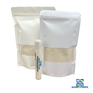 May include: Two white resealable bags filled with a white powder. A clear plastic tube with a blue and white label that reads "BIOACTIVEFX  Cuttle Bone for Hermit Crabs  100% Natural  No Additives" is in front of the bags.