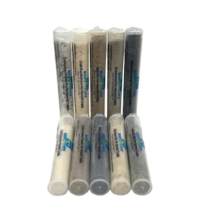 May include: Eight clear plastic tubes containing different types of food for hermit crabs. The tubes are labeled with the ingredients and the brand name "BIOACTIVEPX".