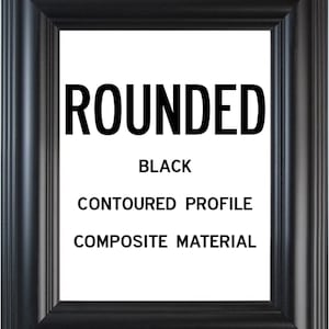 May include: Black picture frame with a rounded edge and a contoured profile. The frame is made of composite material. The text "ROUNDED" is printed in bold white letters on the frame.