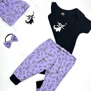 May include: A baby outfit set featuring a white bodysuit with a black Jack Skellington design, a black bodysuit with a white Jack Skellington design, purple trousers with a black Jack Skellington pattern, a purple headband with a black bow, and a purple hat with a black Jack Skellington pattern.