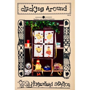 May include: A sewing pattern for a quilted wall hanging featuring four appliquéd chickens. The pattern is titled "Cluckin' Around" and is from Homestead Station. The pattern includes instructions for making stuffed chickens.