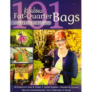 May include: A book cover titled "101 Fabulous Fat-Quarter Bags" with images of colorful fabric bags. The cover features a woman holding a dog and a bag. The book includes projects for totes, purses, handles, closures, embellishments, trim, embroidery, and beads.