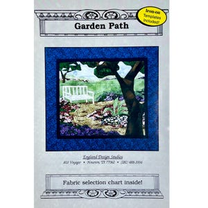 May include: A fabric panel for a quilt project titled "Garden Path." The design features a serene garden scene with a white bench, trees, and colorful flowers. The panel includes the text "Iron-on Templates Included!" and "Fabric selection chart inside!"