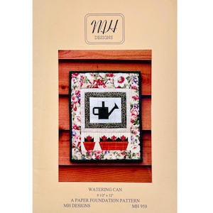 May include: A quilted wall hanging featuring a watering can design. The artwork includes a black watering can, red tulips, and floral patterns. The dimensions are 9 1/2" x 12". The text "MH Designs" and "Watering Can" are also visible.