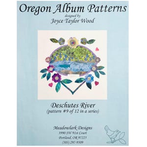 May include: A light blue paper with the text "Oregon Album Patterns" and "Deschutes River". The artwork features a landscape scene with a river, flowers, and foliage. Designed by Joyce Taylor Wood.