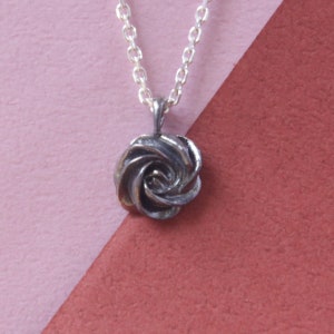 tiny silver black rose bud cake pendant
