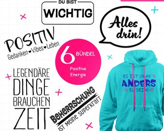 May include: A teal hoodie with pink drawstrings and the text "ES IST OKAY ANDERS ZU SEIN!" in blue. The image also includes various German phrases and graphics, such as "DU BIST WICHTIG" and "POSITIV".