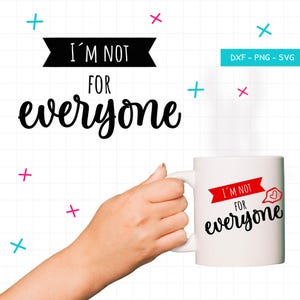 May include: A white ceramic mug featuring the black text I'M NOT FOR everyone and a red banner graphic with a small heart icon. The design is displayed against a white grid background with scattered pink and blue plus and cross symbols.