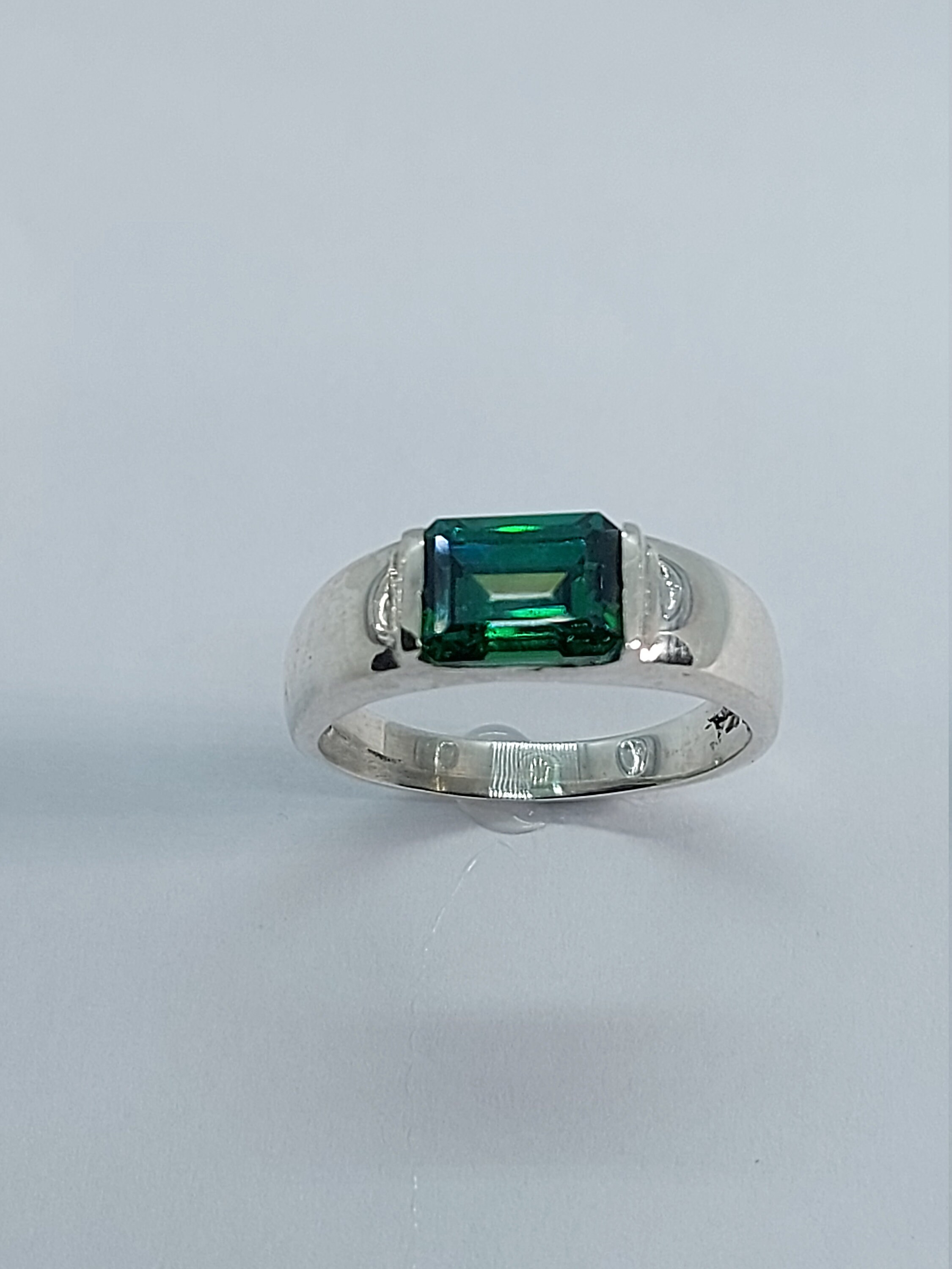 6.25 Carat Simulated Emerald and 1.10 ct. t.w. CZ Three