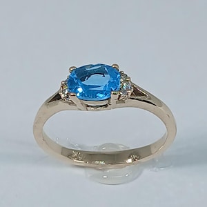 10k Yellow Gold Blue Topaz Ring with Diamond Accents