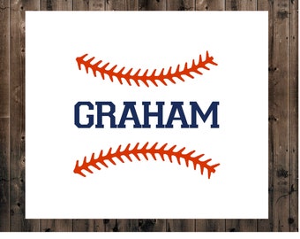 May include: A white background with a wooden frame. The center of the image features a baseball stitch design in orange and a navy blue text that reads "GRAHAM".