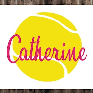 May include: A yellow tennis ball with the name "Catherine" written in pink cursive.