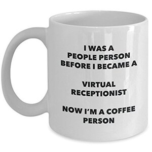 May include: White ceramic coffee mug with black text that reads "I was a people person before I became a virtual receptionist. Now I'm a coffee person."