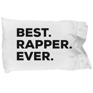 May include: White pillow with black text that reads "BEST. RAPPER. EVER."