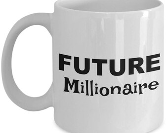 May include: White ceramic coffee mug with black text that reads "FUTURE Millionaire".