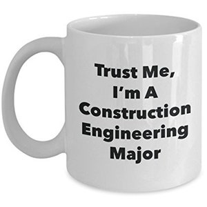 May include: White ceramic coffee mug with black text that reads "Trust Me, I'm A Construction Engineering Major".