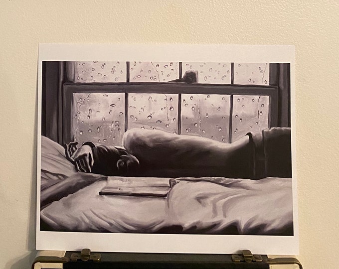 Nadir Art Print black and white rainy day book bed art