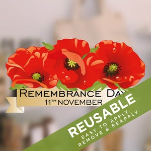 May include: Red poppy flower sticker with the text "REMEMBRANCE DAY 11th NOVEMBER" and "REUSABLE EASY TO APPLY, REMOVE & REAPPLY" on a green and gold ribbon.