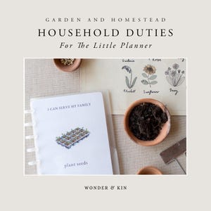 May include: A white planner with a clear cover and a colorful illustration of a plant tray with seedlings. The text "I can serve my family" and "plant seeds" is printed on the planner. The planner is on a beige surface with a small terracotta pot filled with soil and a gardening tool.
