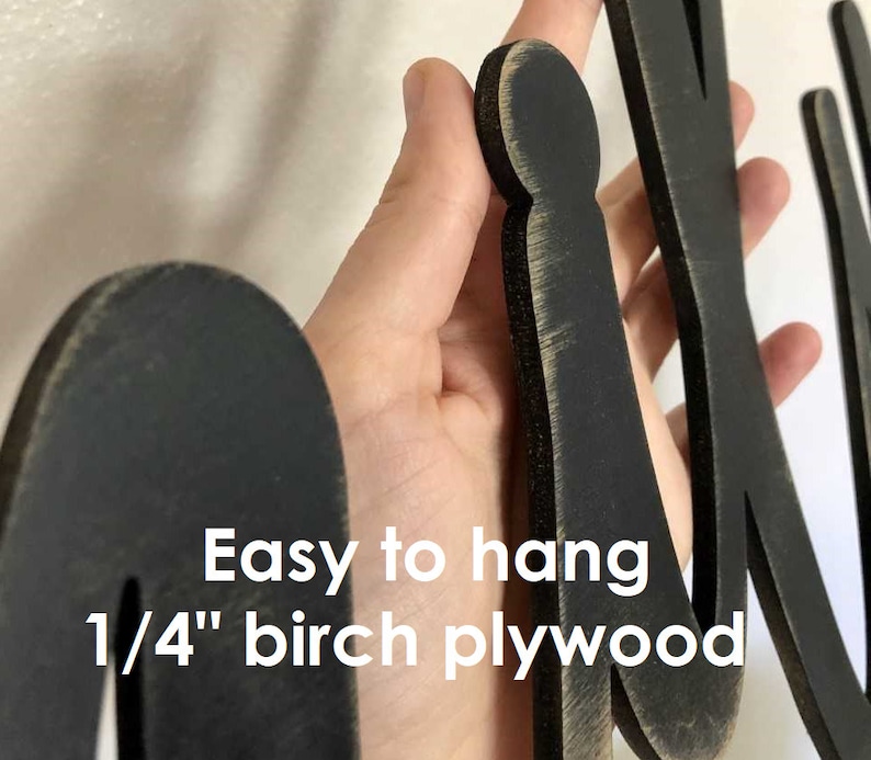 May include: Black wooden letters spelling "Mix" with a distressed finish. The letters are 1/4 inch thick birch plywood and are easy to hang.