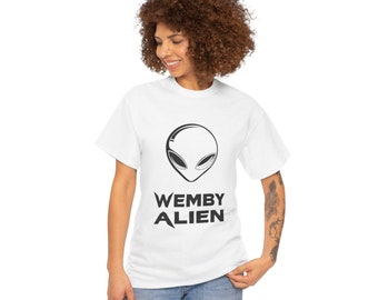 May include: White t-shirt with a black alien graphic and the text "WEMBY ALIEN" printed on the front.
