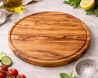 Tabla redonda de madera de olivo personalizada para pizza y carne