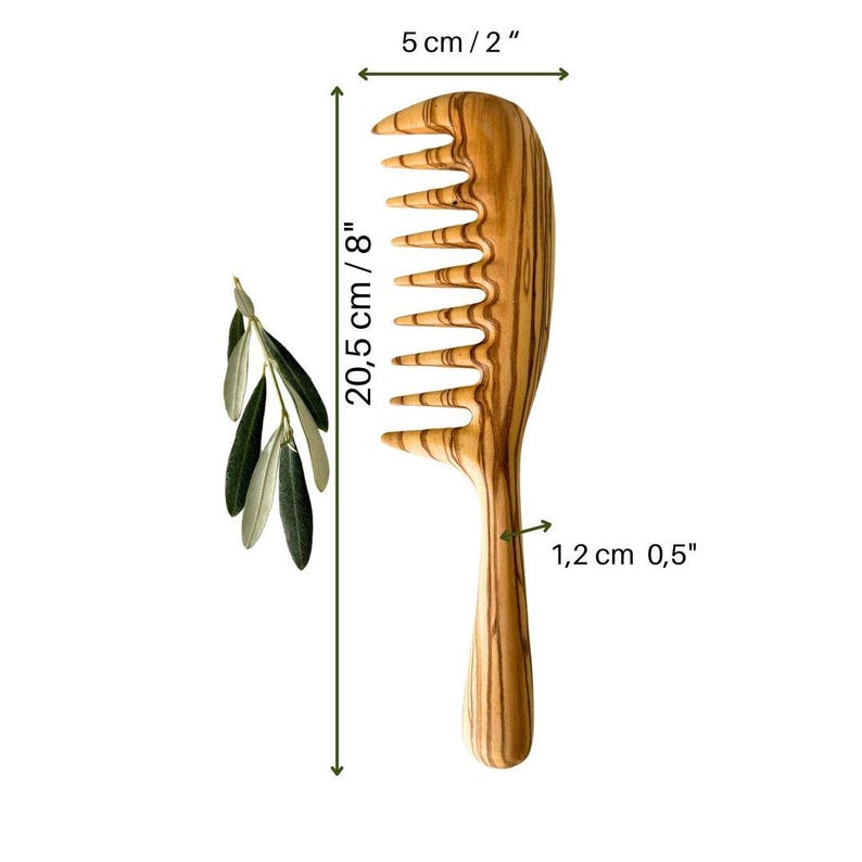 May include: A wooden comb with a wide tooth design, measuring 8 inches long and 2 inches wide. The comb is made of olive wood and has a natural wood grain pattern.