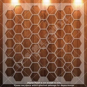 May include: A white honeycomb pattern stencil on a wood background. The stencil is made of a thin, flexible material and is designed to be used with paint or other mediums.