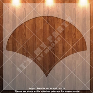 May include: A white cutout of a fan shape on a woodgrain background. The cutout is a simple design with a rounded top and two points at the bottom.