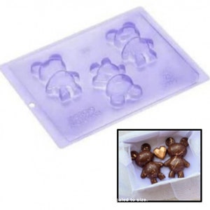 May include: A clear plastic mold with three bear-shaped cavities. The mold is designed to create chocolate bears. A photo of three chocolate bears is shown below the mold.