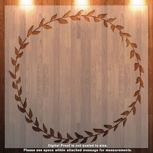 May include: A digital proof of a woodgrain background with a brown leafy wreath design. The text "Digital Proof is not scaled to size. Please see specs within attached message for measurements." is at the bottom of the image.