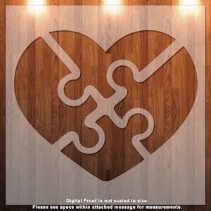 May include: A white heart-shaped puzzle piece design on a wood background. The puzzle pieces are interlocking, symbolizing love and unity.