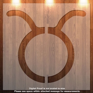 May include: A brown wooden sign with a cutout of the Taurus zodiac symbol. The sign has a wood grain texture and is illuminated by three light bulbs.