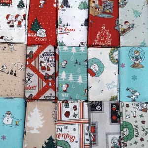 FAT QUARTER BUNDLE Peanut Snoopy&#39;s Christmas. Cotton fat quarters featuring Snoopy, Woodstock, Charlie Brown, Sally Brown, Lucy & Linus.