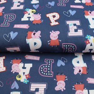 PEPPA PIG Cotton Fabric. Whimsical navy blue cotton with cheeky Peppa Pig, letters, hearts & flowers. Perfect for sewing crafts and quilting