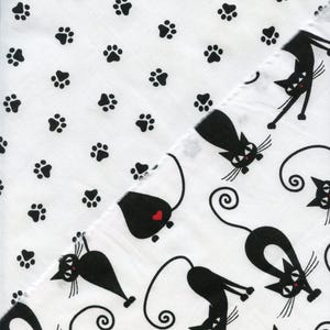 CATS & PAW PRINTS cotton fabrics. Cheeky cartoon cats an paw prints on white background. Perfect for craft, quilting and sewing projects.