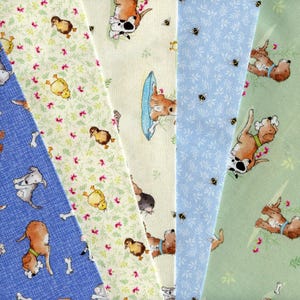 A DOG&#39;S LIFE cotton fabric with dogs, chicks and ducklings. Suitable for sewing and quilting. Sold by the meter or as fat quarter bundles.